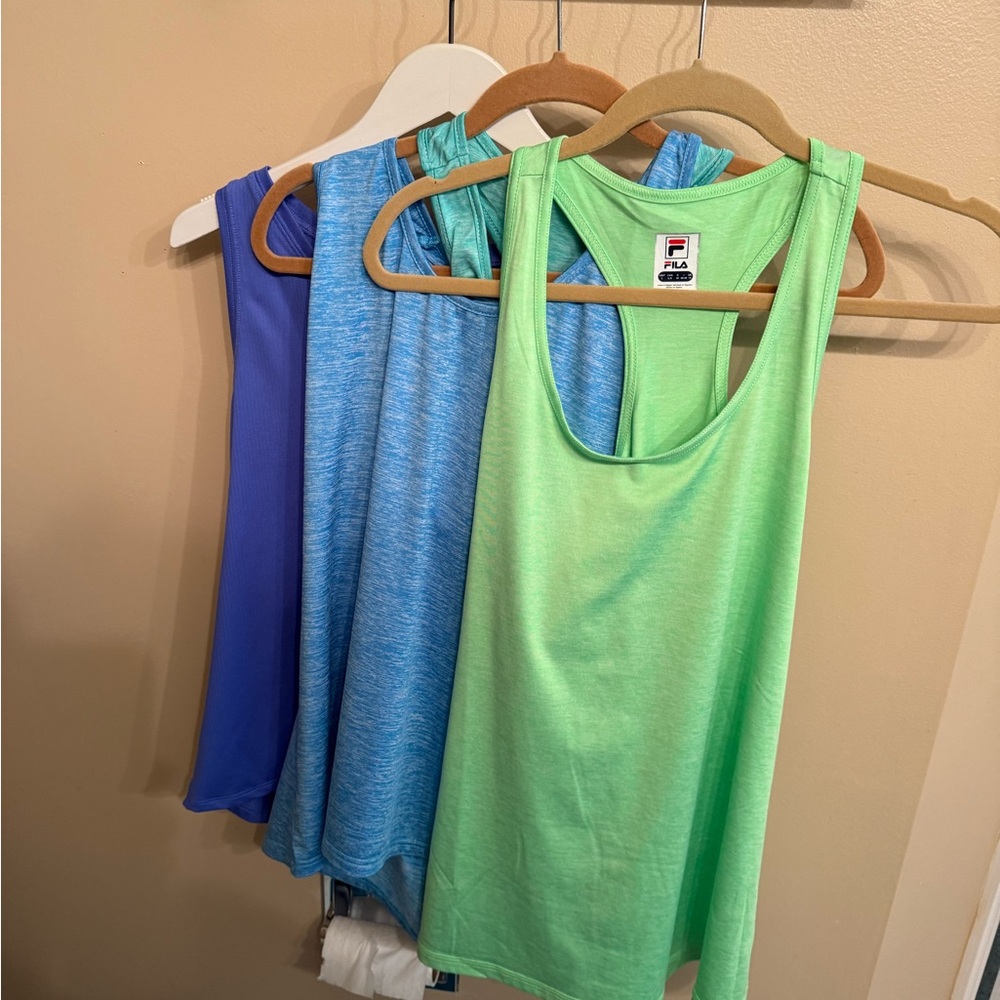 4 Multi colored athletic tanks